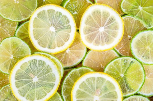 Background made of fresh lime and lemon slices