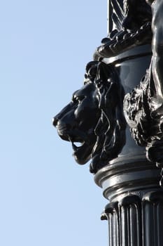 Street lamp black metal lion head decoration.