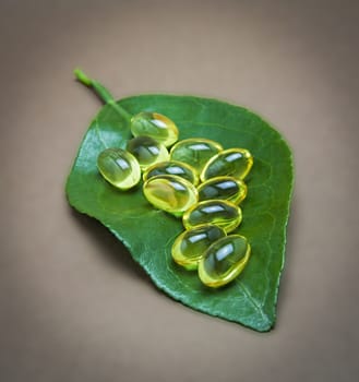 Natural medicine conceptual image with natural pills and a leaf