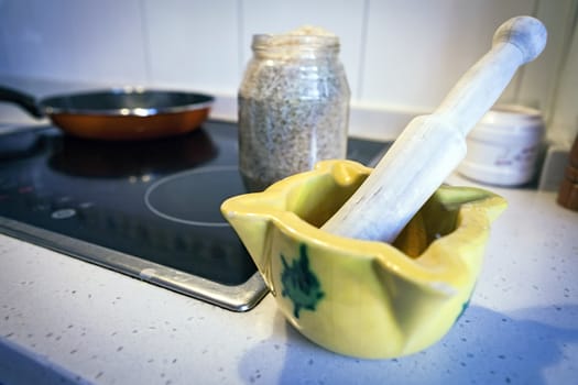 A composition of a ceramic mortar in the kitchen