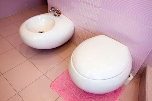 WC and bidet in a beautiful pink bathroom