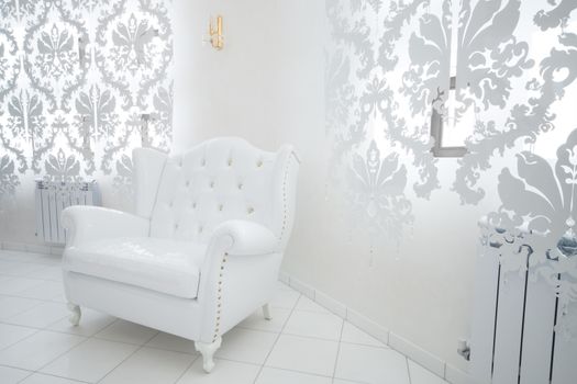 beautiful white armchair in a modern apartment