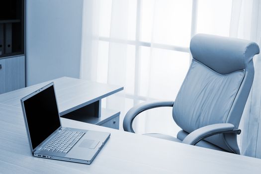 laptop on a desk of director at modern office