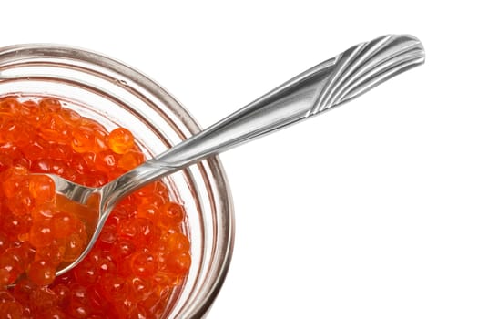 The spoon and red caviar in glass can