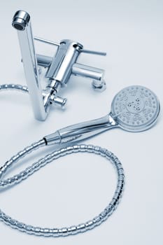 modern metal faucet and shower close up