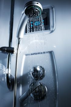 Water from the shower in the modern bathroom