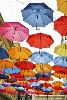 umbrellas in different colors in the street