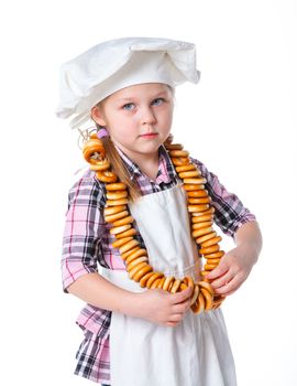 Little Cook With A Bagels In Her Hands. Isolated on white background
