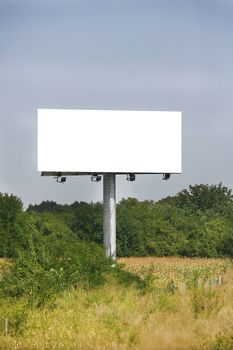 Empty billboard on background of sunset sky for your advertisement