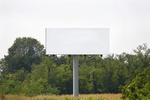 Empty billboard on background of sunset sky for your advertisement