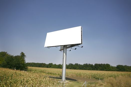 Empty billboard on background of sunset sky for your advertisement