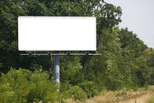 Empty billboard on background of sunset sky for your advertisement