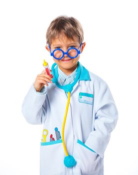 Portrait of a little smiling doctor with stethoscope and syringe. Isolated on white background