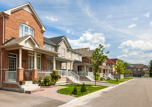 Suburban residential street with red brick houses