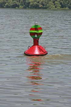 red buoy floating in the river