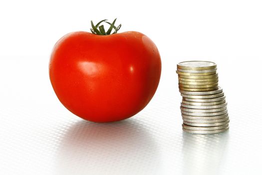 Tomato vegetables pile isolated on white background cutout with coins