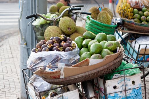 SAI GON, VIET NAM- JULY 21: Fruit store of street vendor on bicycle, Sai Gon, Viet Nam on July 21, 2013