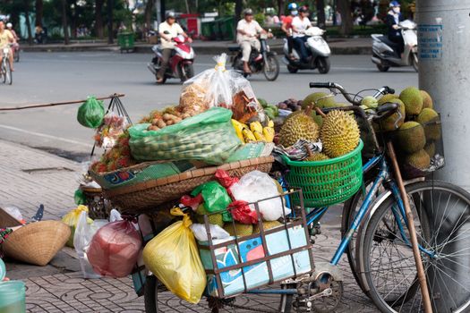 SAI GON, VIET NAM- JULY 21: Fruit store of street vendor on bicycle, Sai Gon, Viet Nam on July 21, 2013