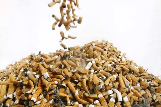 Many cigarette smoked in the crowd, in many countries, smoking is prohibited and encourages a healthy lifestyle and cessation of smoking