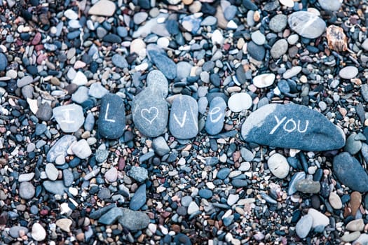 I Love You note on rocks in nature