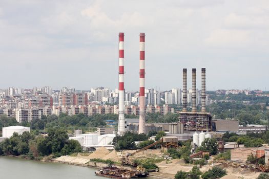 Chimneys of the heating plants, Heating plant in the city by the river