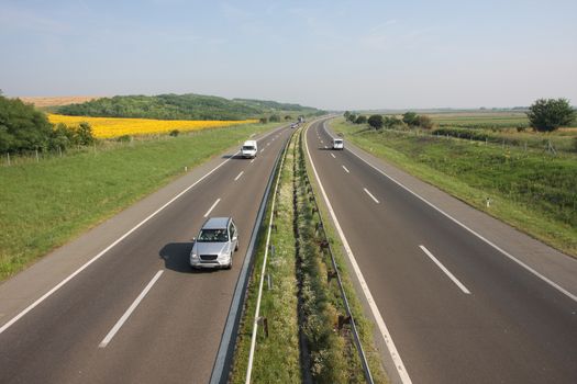 highway at sunny day classic scene of a highway in rural area