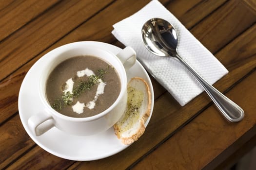 A cup of mushroom soup ready to be served.