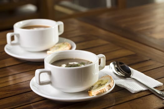 Two cups of mushroom soup ready to be served.