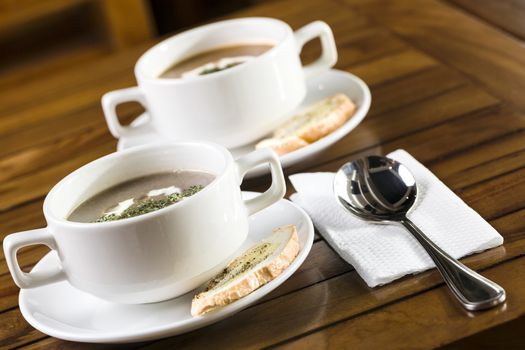 Two cups of mushroom soup ready to be served.