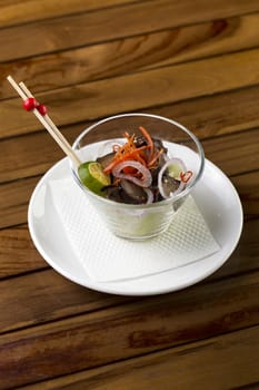 A glass of mushroom appetizer to be served.