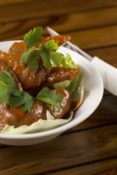 A bowl of Spicy Chicken Wings ready to be served.