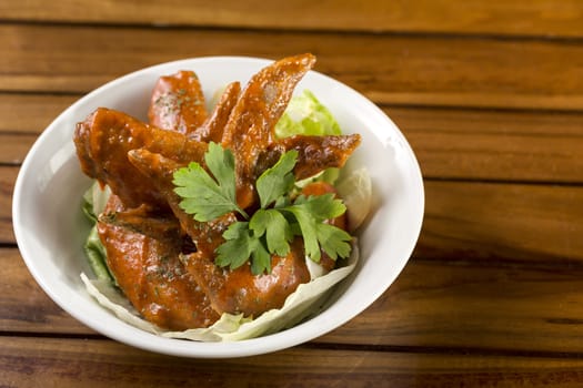 A bowl of Spicy Chicken Wings ready to be served.