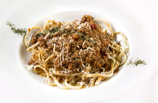 A plate of Spaghetti bolognese isolated on white. 