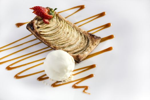 Strawberry biscuit dessert ready to be served with vanila icecream isolated in white.