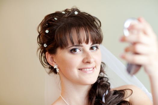 bride with mirror