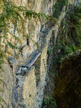 Old Inca's bridge near lost city of Machu Picchu (Peru)