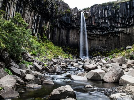 Romantic waterfall in Skaftafell national park (Iceland)