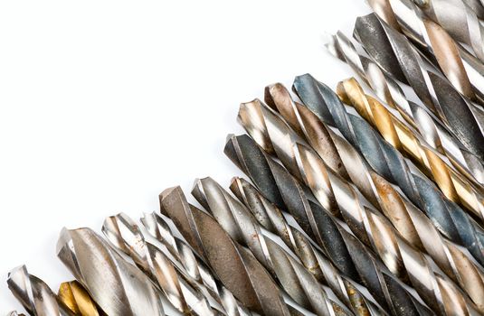 Various used twist drill bits in a row