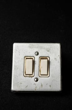 Light switch, old-style on a Black Background