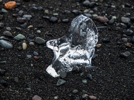 Piece of ice in black sand (Iceland)
