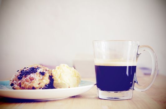 Breakfast with cup of black coffee on wood 