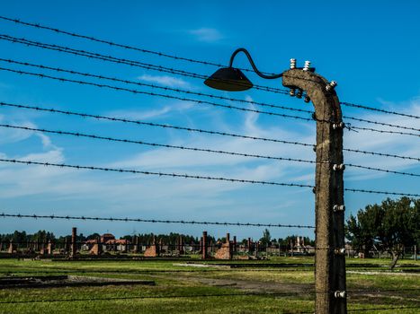 Barb wires and lamp in Birkenau (Poland) Barb wires and lamp in Birkenau
