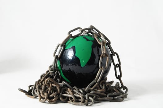 Earth globe close in chain and padlock