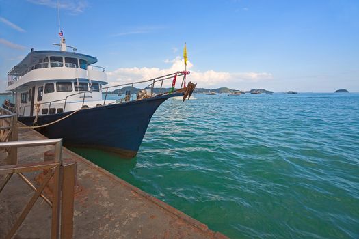 Ships  at berth waiting for tourists, Andaman Sea, Thailand.