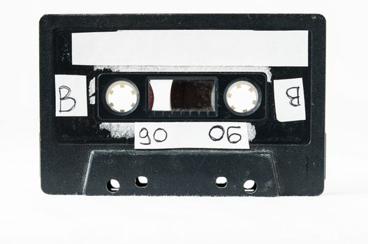 Ancient Vintage Used Musicassette over a White Background