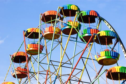 Colorful rainbow ferris wheel in amusement park