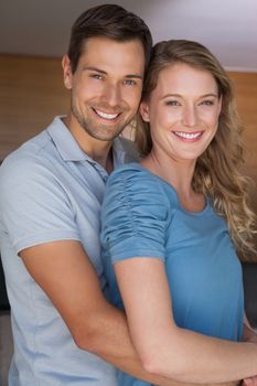 Portrait of a loving young couple smiling at home