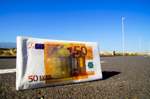 Business Money Concept Banknotes(paper) on the Asphalt Street