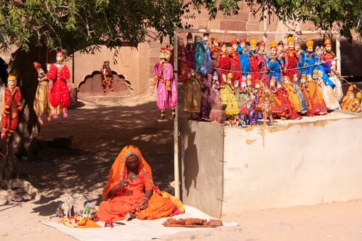 Indian woman selling puppets, Mehrangarh Fort, Jodhpur, Rajasthan, India