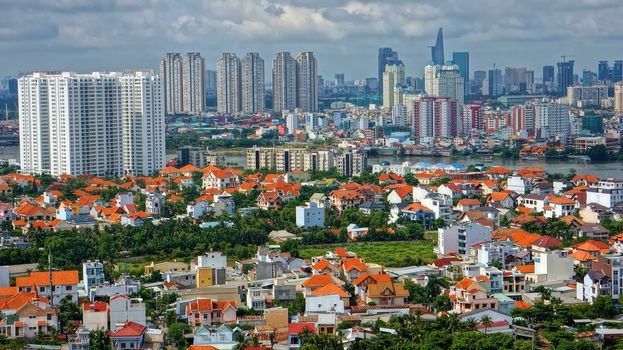 HO CHI MINH CITY ( SAI GON), VIET NAM- SEP 15: Development of mordern city with row of highrise buidling rise up to sky and new urban with villas along river in Ho Chi Minh, Vietnam on Sep 15, 2012